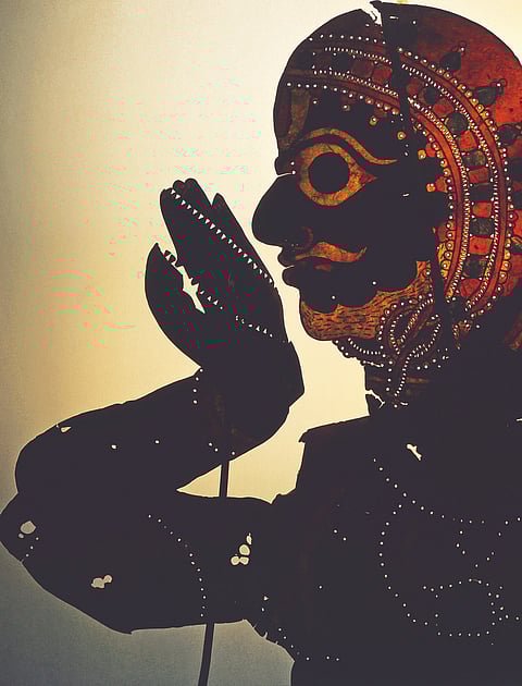 A shadow puppet of painted leather