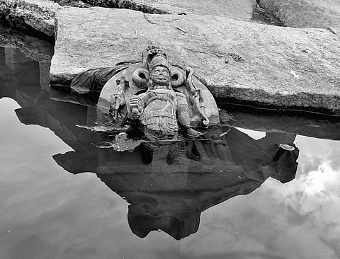 A submerged idol at Hampi