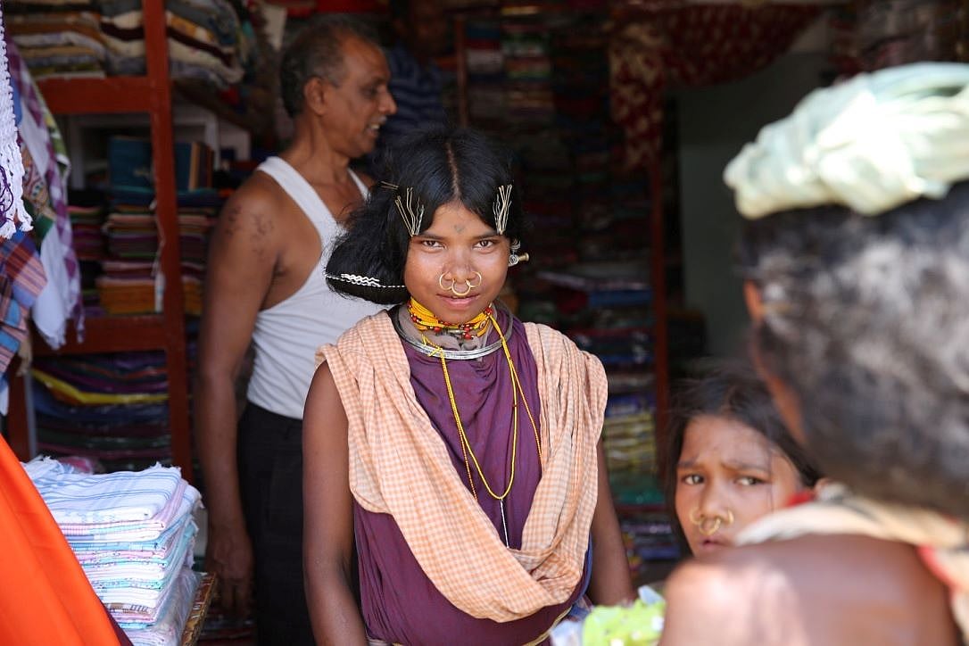 Women from the Dongria Kondh community shopping for textiles in the Muniguda market
