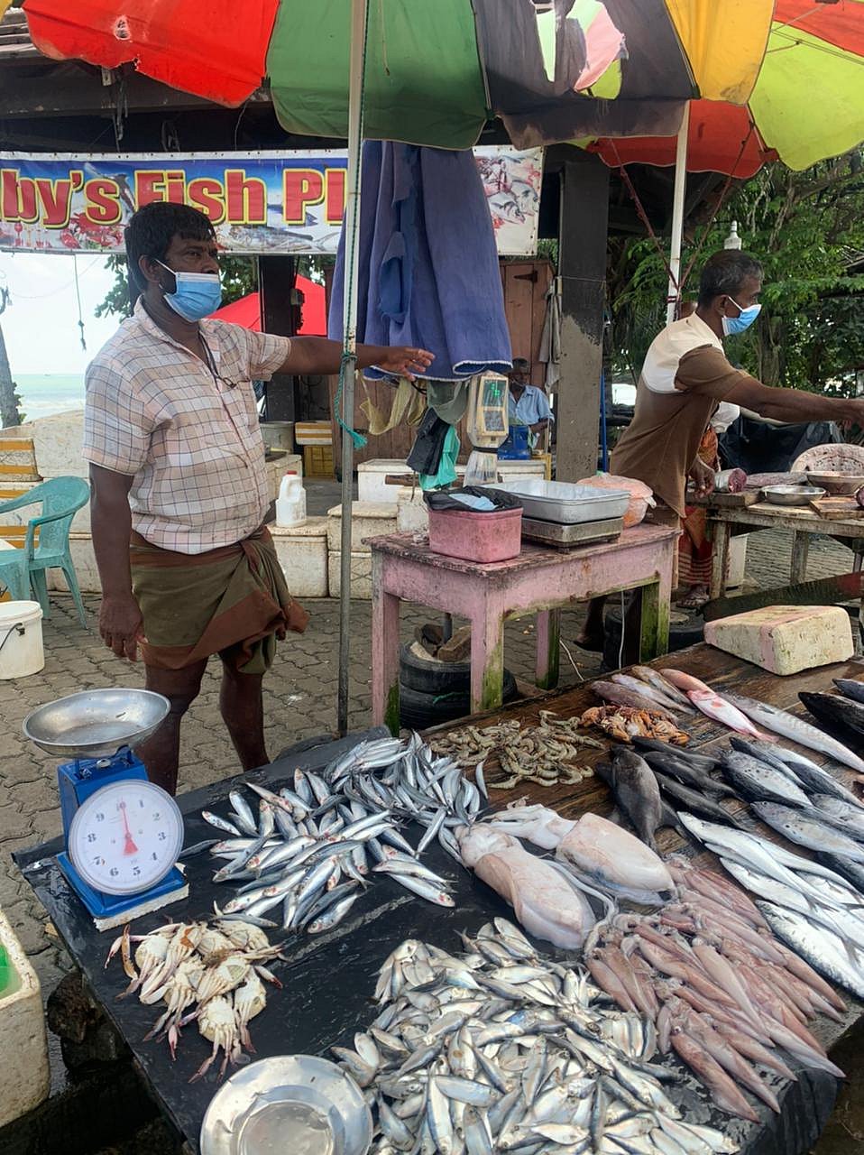 A fish seller at a market in Weligama