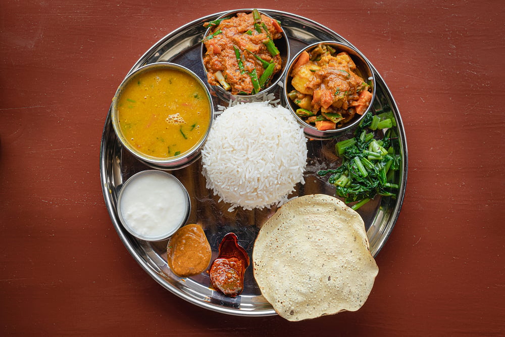 A typical Nepalese thakkali, a thaali with vegetarian and non-vegetarian options)