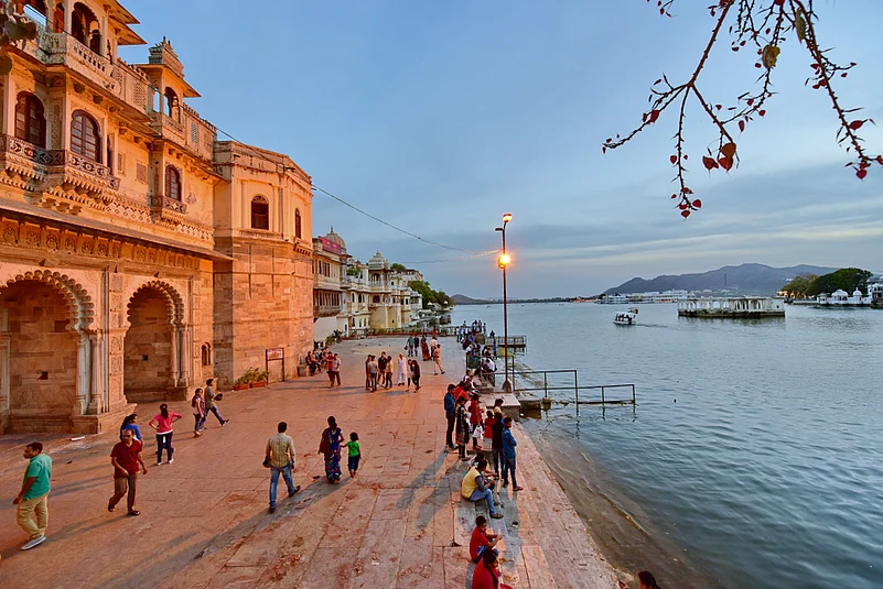 Gangaur Ghat, located in the heart of Udaipur, is a captivating and culturally significant waterfront on the eastern shores of Lake Pichola. Named after the traditional Gangaur festival celebrated with zeal in Rajasthan, the ghat embodies the citys vibrant cultural heritage. Encircled by ancient havelis and temples, the ghat provides a picturesque view of the City Palace and Jag Mandir across the lake. It is a popular spot for locals and tourists, offering boat rides and a serene ambience. Gangaur Ghat comes alive during festivals, with lively processions and cultural events showcasing the enduring charm of Udaipur.
