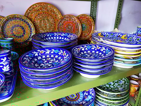 Blue pottery items on sale at a Jaipur store