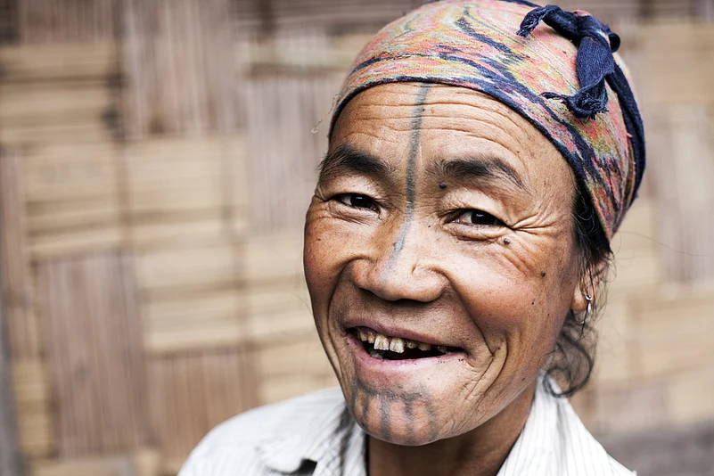 An Apatani woman with a tattooed face