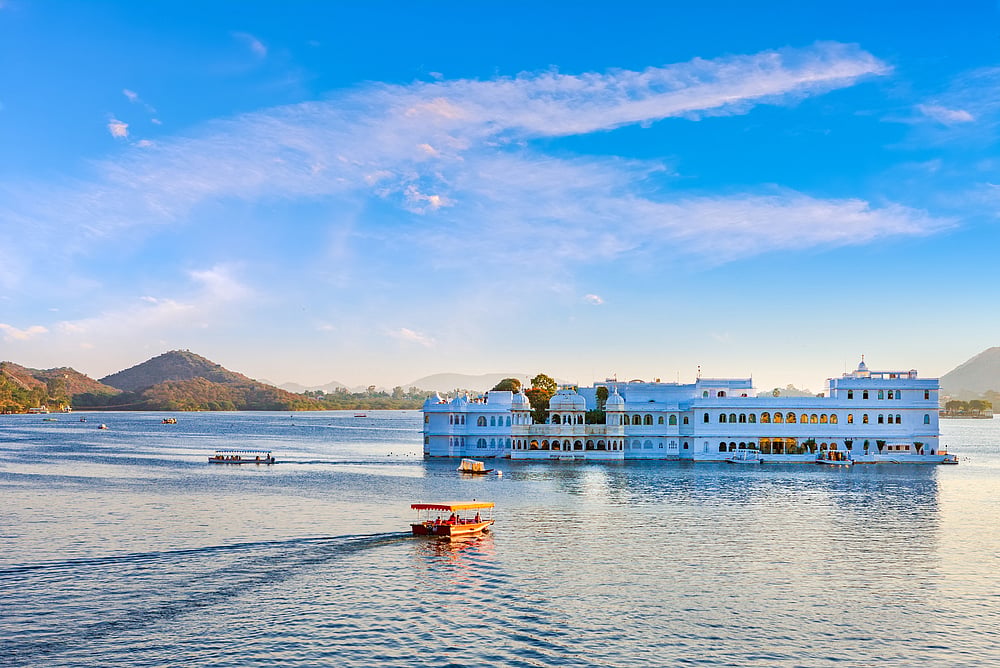 Lake Pichola, located in Udaipur, is a captivating artificial lake renowned for its majestic beauty and historical significance. Created in 1362 AD, it is one of the oldest and largest lakes in the city. Embraced by the Aravalli hills, the lake boasts architectural marvels on its islands, like the City Palace and Jag Mandir. The serene waters provide boat rides, offering mesmerizing views of the surrounding palaces and temples. Lake Pichola is a vital part of Udaipurs cultural heritage and plays a pivotal role in the citys tourism, attracting visitors with its rich history and breathtaking vistas.