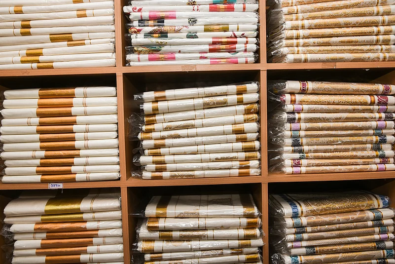 Kasavu saris, trademark white sari with a zari border, at a shop in Kochi