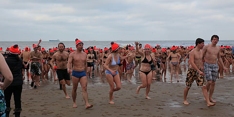 Thousands of Dutch swimmers dive into the North Sea