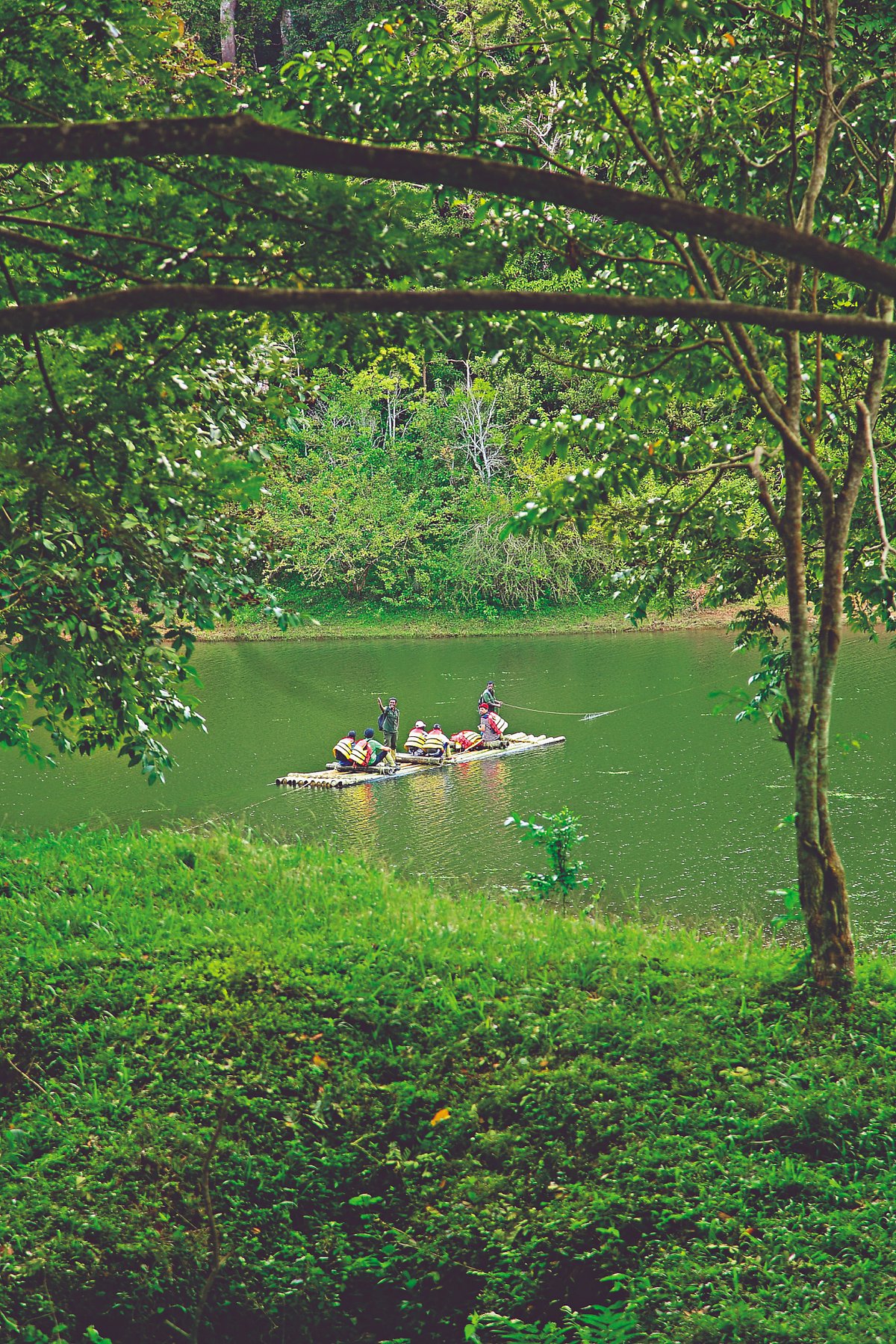 Tourists enjoying bamboo rafting in Periyar Tiger Reserve
