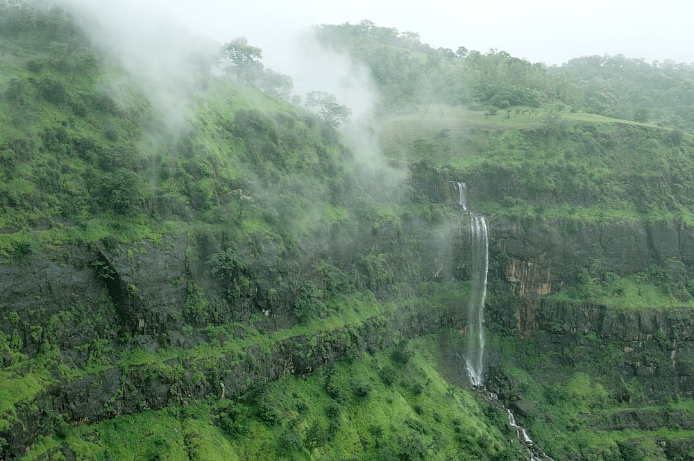 Bhandardhara is known for its lush greenery, waterfalls, and famous Arthur Lake