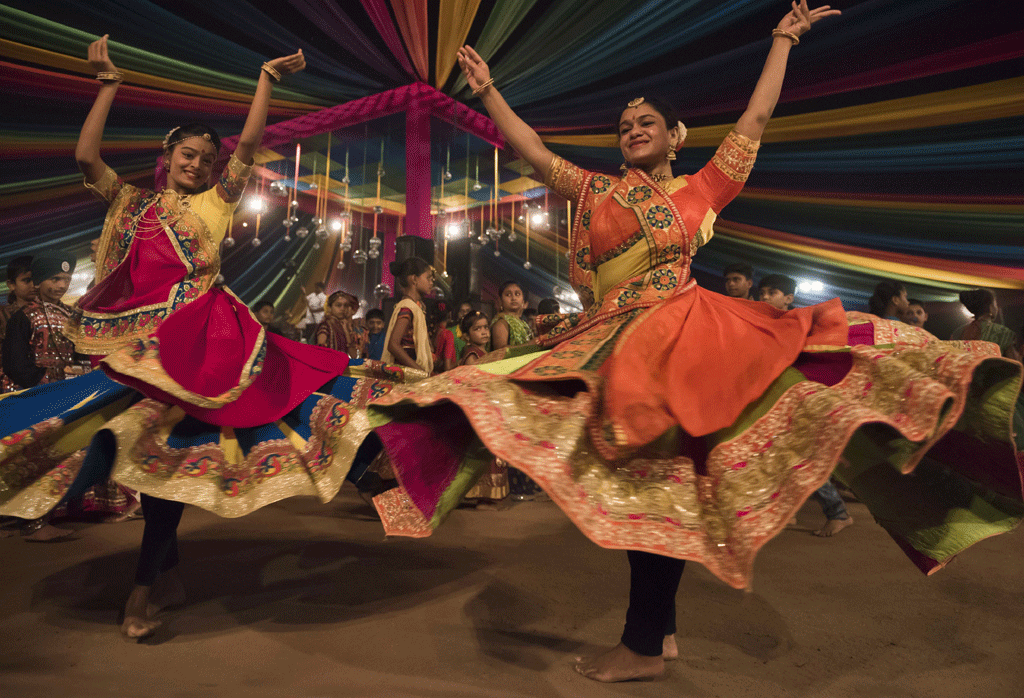Traditionally performed in a circular formation, Garba centres around a clay lantern