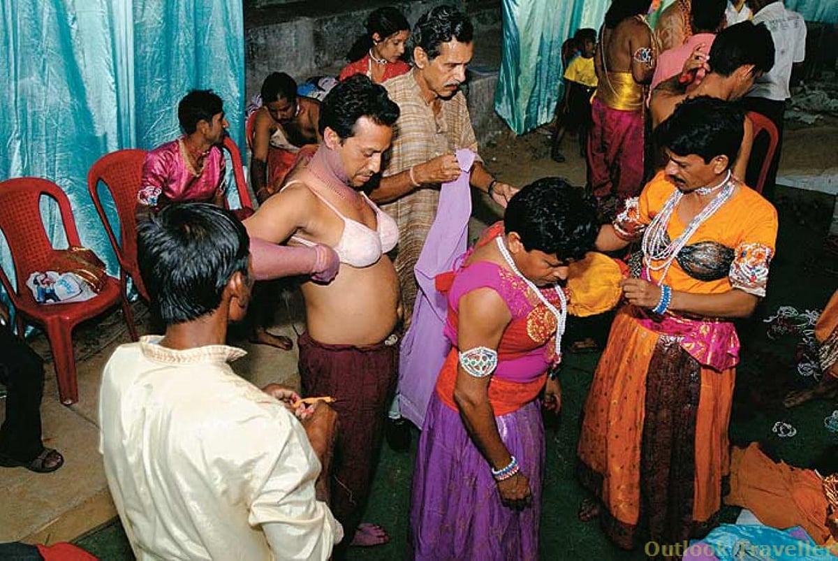 Chhau dancers get ready backstage