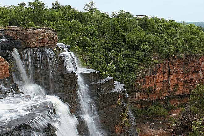 Tirathgarh Waterfalls cascades over a mountainous cliff