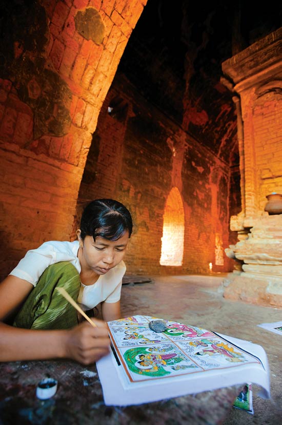 A girl painting souvenirs in Old Bagan