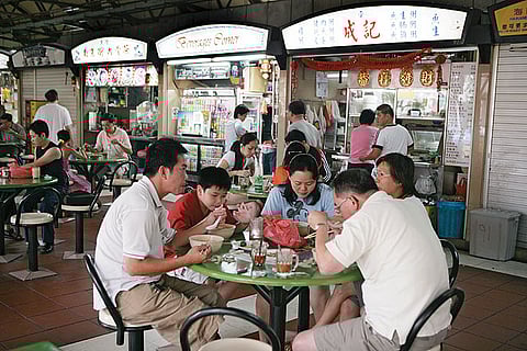 People eating at Maxwell Food centre