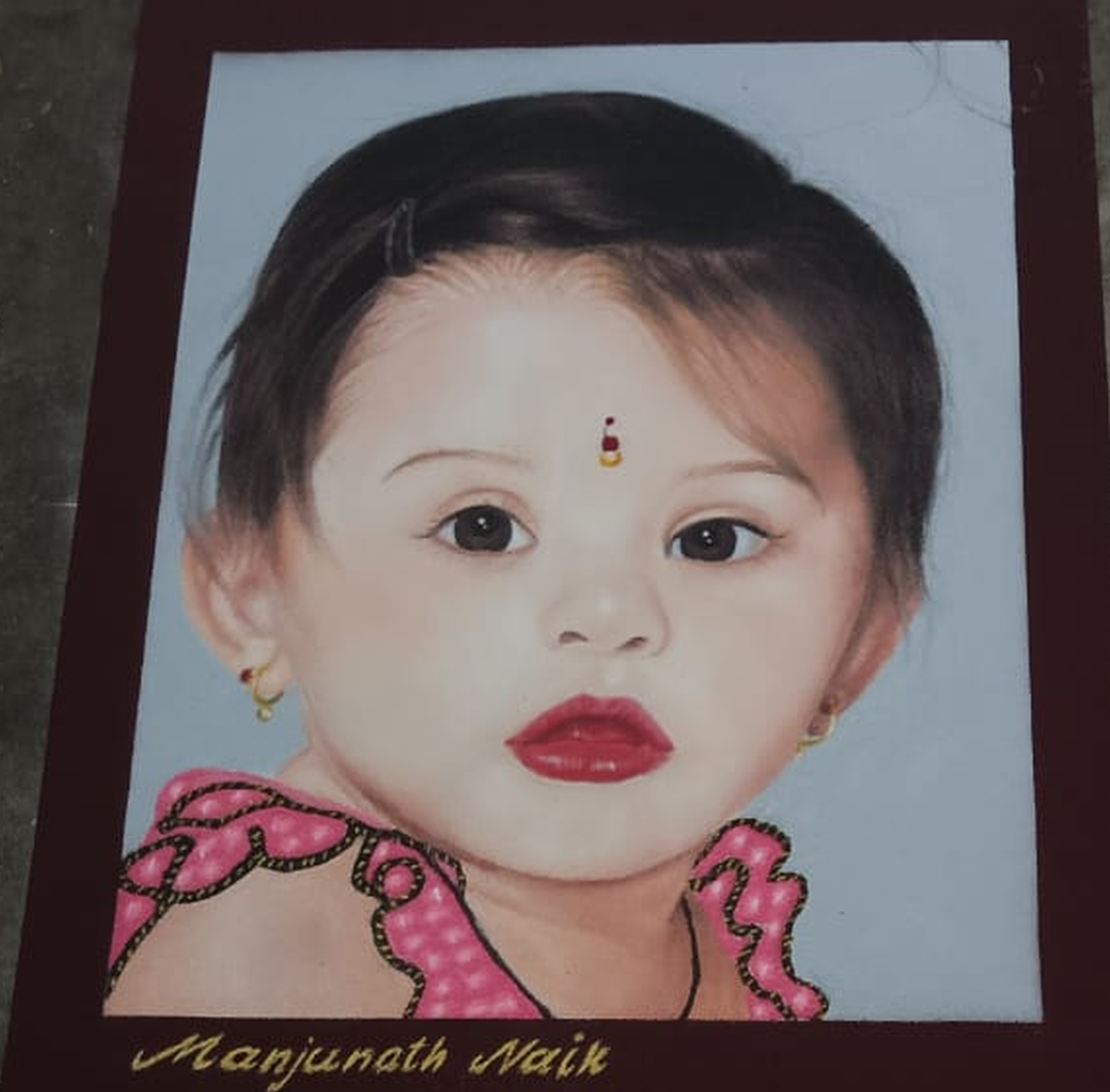 ರಂಗೋಲಿಯಲ್ಲಿ ಮೂಡಿದ ಪುಟ್ಟ ಮಗು