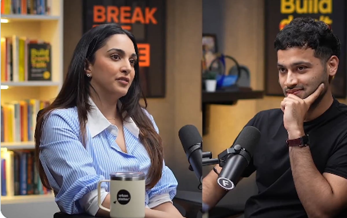 Bollywood actress Kiara Advani smiles during a public event, discussing life.