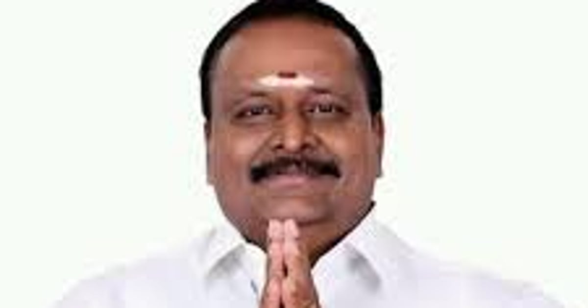 AMMK party symbol with a politician speaking in Tamil Nadu assembly