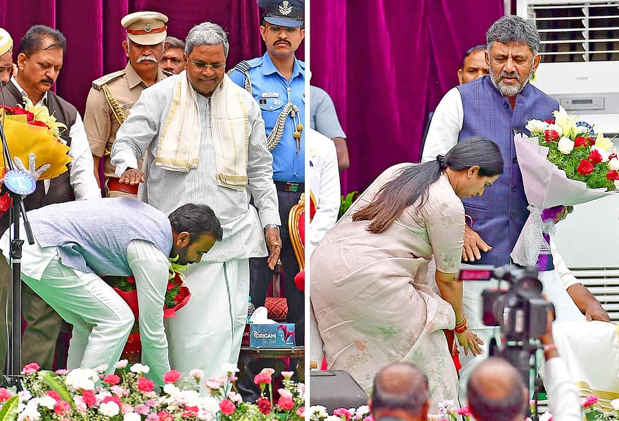 ರಾಜಭವನದ ಗಾಜಿನಮನೆಯಲ್ಲಿ ಶನಿವಾರ ನಡೆದ ಪ್ರಮಾಣವಚನ ಸಮಾರಂಭದಲ್ಲಿ ನೂತನ ಸಚಿವರಾದ ಸಂತೋಷ್ ಲಾಡ್ ಅವರು ಮುಖ್ಯಮಂತ್ರಿ ಸಿದ್ದರಾಮಯ್ಯ ಅವರ ಕಾಲಿಗೆ ಹಾಗೂ ಲಕ್ಷ್ಮೀ ಹೆಬ್ಬಾಳಕರ ಅವರು ಉಪ ಮುಖ್ಯಮಂತ್ರಿ ಡಿ.ಕೆ. ಶಿವಕುಮಾರ್‌ ಅವರ ಕಾಲಿಗೆ ನಮಸ್ಕರಿಸಿದರು –ಪ್ರಜಾವಾಣಿ ಚಿತ್ರ/ರಂಜು ಪಿ.