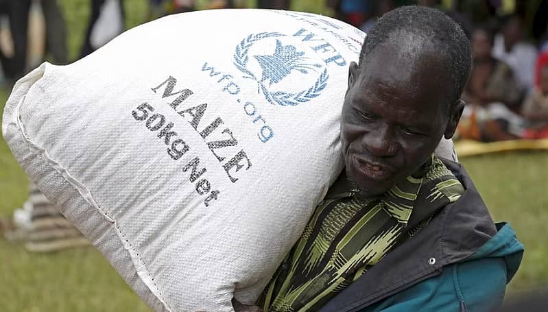 <div class="paragraphs"><p>ಅಕ್ಕಿಯನ್ನು  ಕೊಂಡೊಯ್ಯುತ್ತಿರುವ ವ್ಯಕ್ತಿ </p></div>