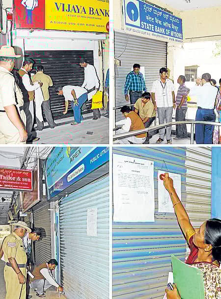 ಪರವಾನಗಿ ಶುಲ್ಕವನ್ನು ಬಾಕಿ ಉಳಿಸಿಕೊಂಡಿದ್ದ ಮಹಾತ್ಮ ಗಾಂಧಿ ರಸ್ತೆಯ ನೇತಾಜಿ ಸುಭಾಷ್ ಚಂದ್ರ ಬೋಸ್ ವಾಣಿಜ್ಯ ಸಂಕೀರ್ಣದಲ್ಲಿರುವ (ಪಬ್ಲಿಕ್ ಯುಟಿಲಿಟಿ ಬಿಲ್ಡಿಂಗ್) ಸ್ಟೇಟ್ ಬ್ಯಾಂಕ್ ಆಫ್ ಮೈಸೂರು, ಅಪೆಕ್ಸ್ ಬ್ಯಾಂಕ್, ವಿಜಯ ಬ್ಯಾಂಕ್ ಮತ್ತು ಅಂಚೆ ಕಚೇರಿಯ ಶಾಖೆಗಳಿಗೆ ಬಿಬಿಎಂಪಿ ಅಧಿಕಾರಿಗಳು ಸೋಮವಾರ ಬೀಗಮುದ್ರೆ ಹಾಕಿದರು -ಪ್ರಜಾವಾಣಿ ಚಿತ್ರಗಳು