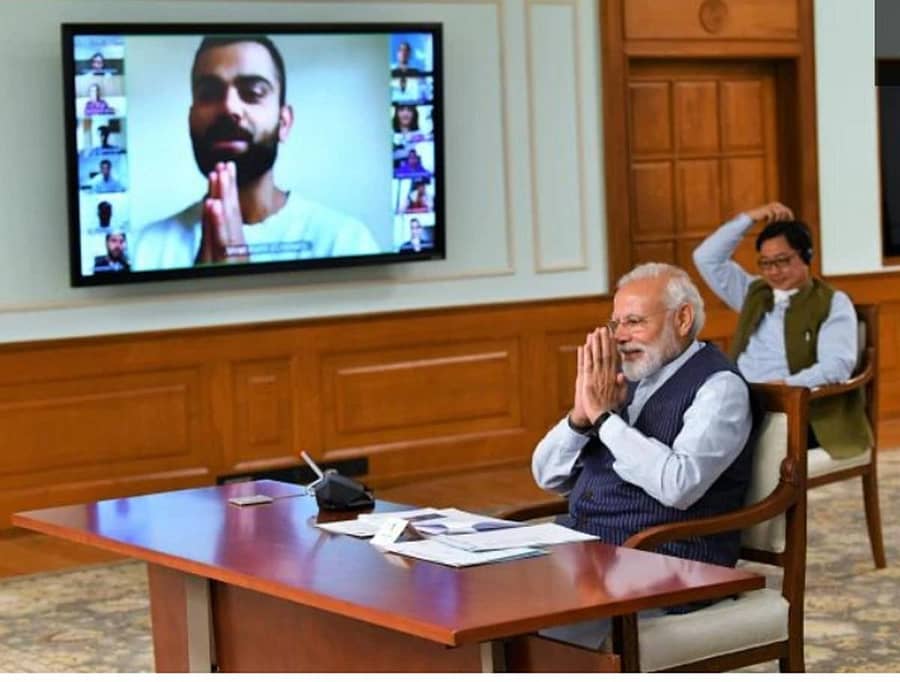 ಭಾರತ ಕ್ರಿಕೆಟ್ ತಂಡದ ನಾಯಕ ವಿರಾಟ್ ಕೊಹ್ಲಿ ಮತ್ತು ಕ್ರೀಡಾತಾರೆಗಳೊಂದಿಗೆ ಶುಕ್ರವಾರ ಪ್ರಧಾನಿ ನರೇಂದ್ರ ಮೋದಿ ವಿಡಿಯೊ ಸಂವಾದ ನಡೆಸಿದರು. ಕ್ರೀಡಾ ಸಚಿವ ಕಿರಣ್ ರಿಜಿಜು ಹಾಜರಿದ್ದರು –ಪ್ರಧಾನಿಗಳ ಟ್ವಿಟರ್ ಖಾತೆಯ ಚಿತ್ರ