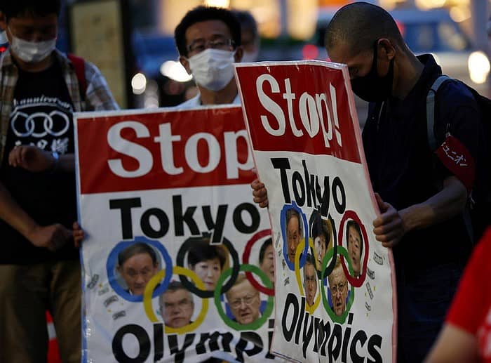 ಒಲಿಂಪಿಕ್ಸ್ ರದ್ದುಗೊಳಿಸುವಂತೆ ಆಗ್ರಹಿಸಿ ಟೋಕಿಯೊದಲ್ಲಿ ಮೆರವಣಿಗೆ