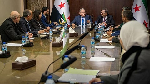 محمد برنية، وعبدالقادر الحصرية خلال الاجتماع