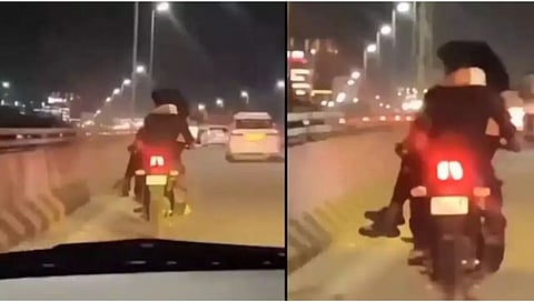 चालत्या बाईकवर प्रेयसीला मांडीवर बसवून प्रियकराचा ओपन रोमान्स!(Video)