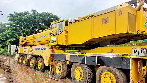 The angry mob vandalized the crane