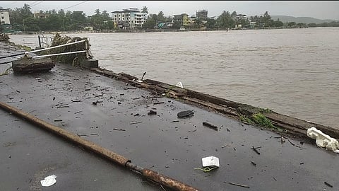 The retaining walls and pipes on the Kundlika river bridge were broken