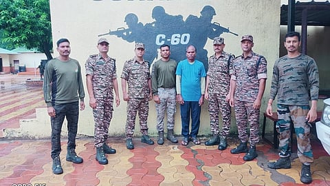 The naxal surrendered to police.