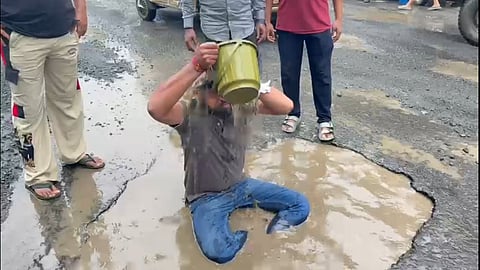 Viral protest pothole bath