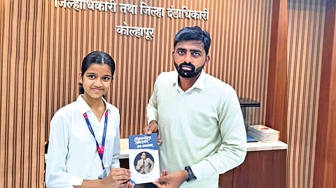 Student interviews district collector 