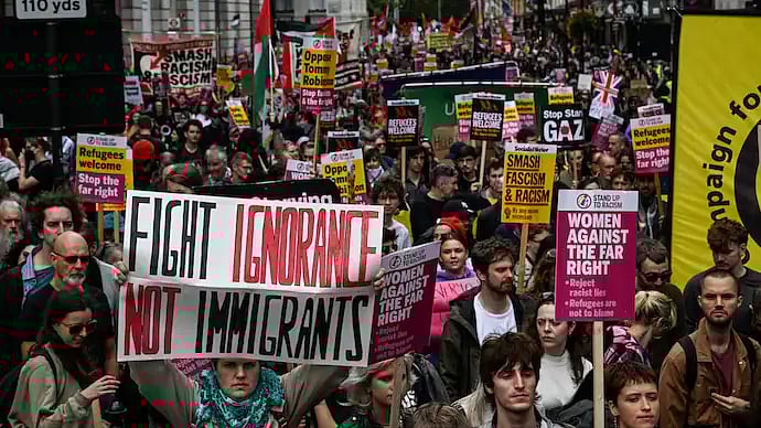 குடியேற்றத்திற்கு எதிராக லண்டனில் பேரணி.. குழுவினரைக் கூட்டிய டாமி ராபின்சன் யார்?