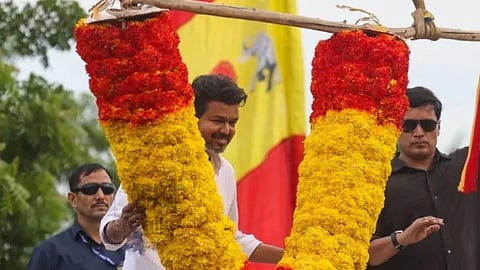 Vijay garlanded by JCB