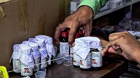 doctor arrested for prescribing cough syrup linked to 14 childrens deaths in madhya pradesh