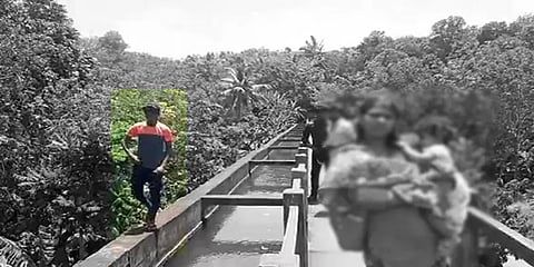 உயரமான பாலத்தில் உயிரை பணயம்வைத்து கைப்பிடி சுவரில் நடந்து சென்ற இளைஞரால் பரபரப்பு