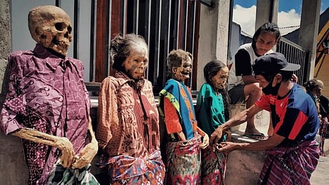 People dressing up their ancestors-Toraja Death ritual 