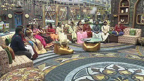 Housemates gathered in living area for task