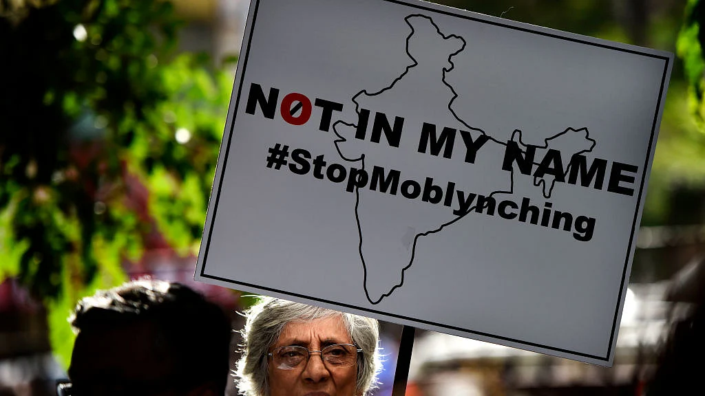 موب لنچنگ کے خلاف مظاہرے کی ایک تصویر/Getty Images