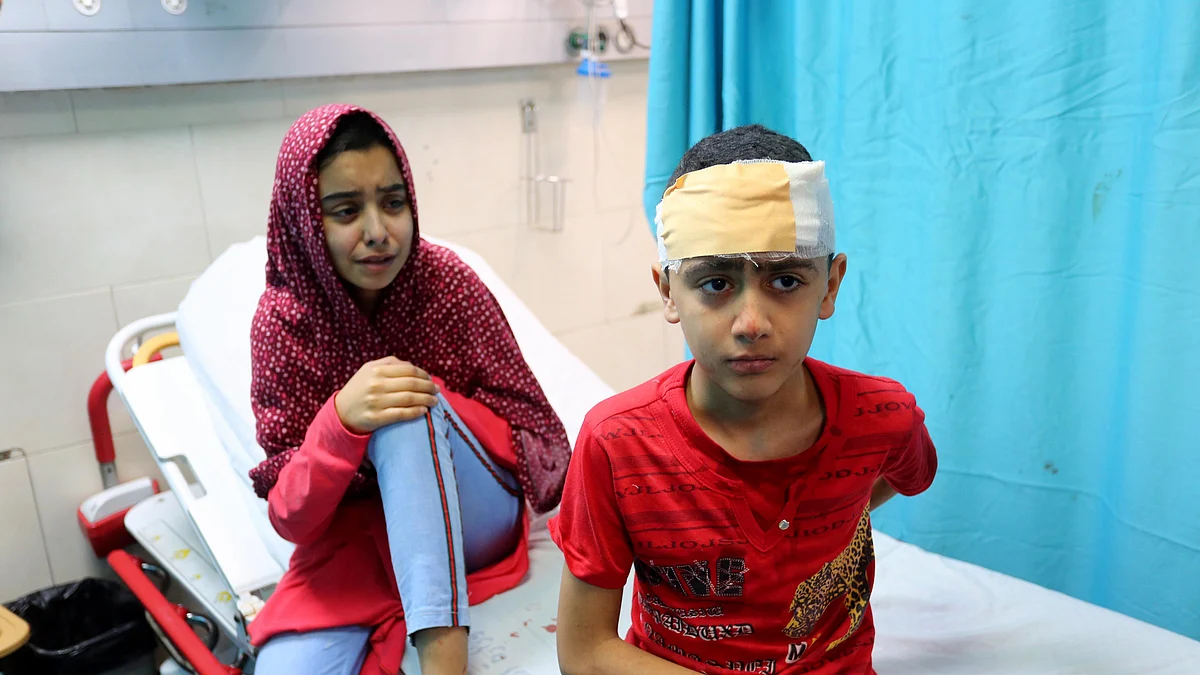GAZA: Kids injured in Israeli attack carried out to home of Palestinian Abu Khatab Familiy, receive treatment at Shifa Hospital in Gaza City