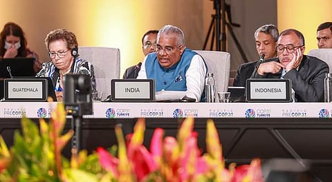 India’s Environment Minister Bhupender Yadav speaking at the Pre-COP31 plenary, seated between representatives from Guatemala and Indonesia, with country nameplates and Pre-COP31 branding visible.