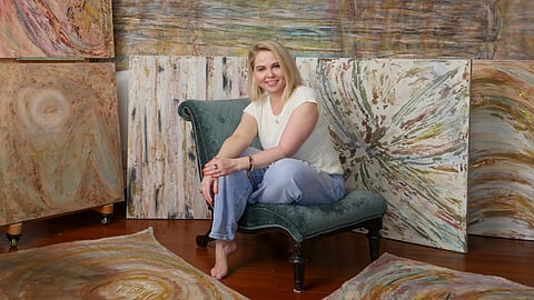 Kasia Muzyka Poses With Her "The Sacred Condition of Being" Collection