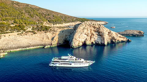 Aerial View of MS San Antonio Anchored by Croatia’s Iconic Rock Formations