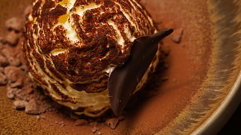 Doma’s Signature Tiramisu, Finished With Cocoa and Dark Chocolate Shards