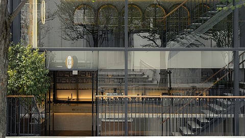 Glass Façade Reveals a Three-Level Immersive Coffee Experience