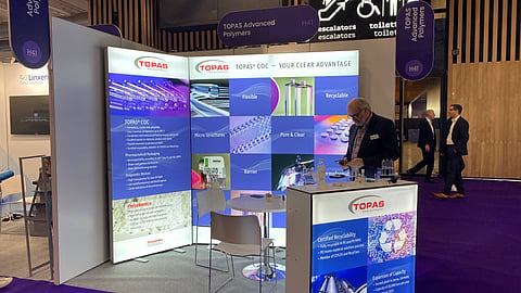 TOPAS trade show booth with clean design and illuminated panels