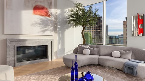 Curved sofa and city views in a sunlit modern living room
