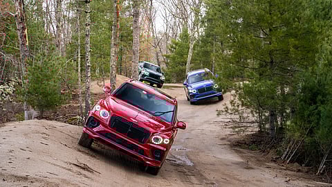 Three Bentley Bentayga SUVs tackling rugged off-road trails