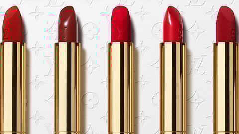 Louis Vuitton gold lipstick tubes with monogrammed caps